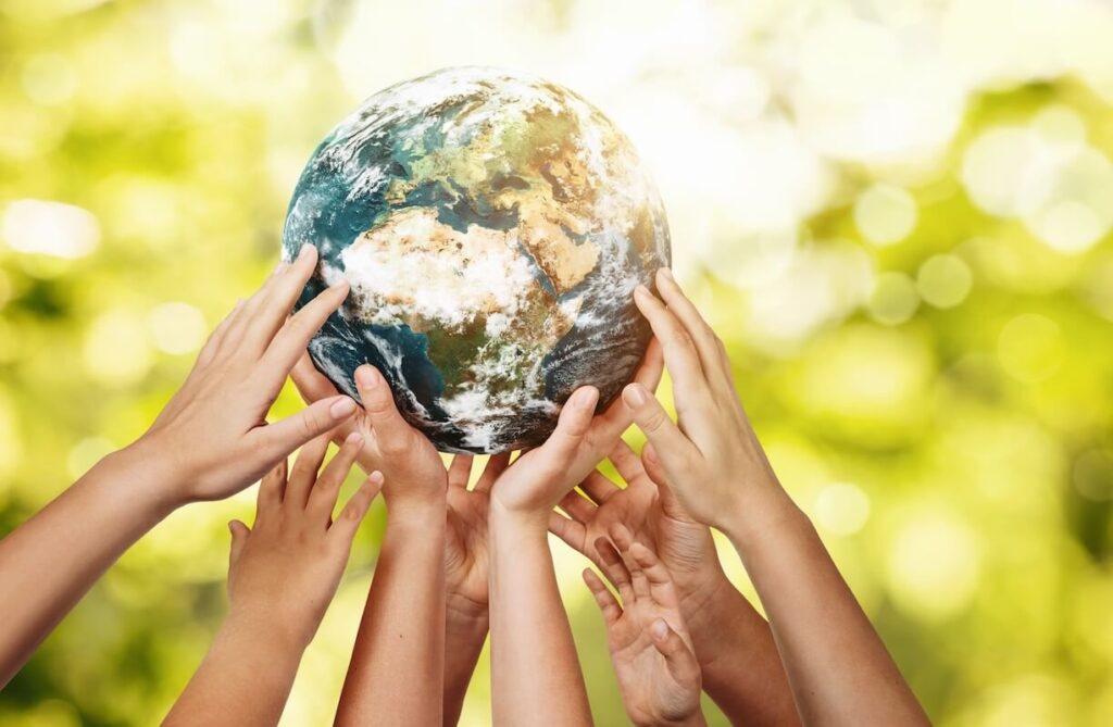Stock photo of hands holding a globe.