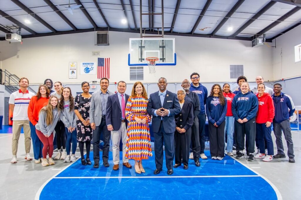 Shenandoah University, Mount Carmel Baptist Church Announce Community Partnership Group photo of individuals from Shenandoah University and Mount Carmel Baptist Church inside the church's Family Life Center.