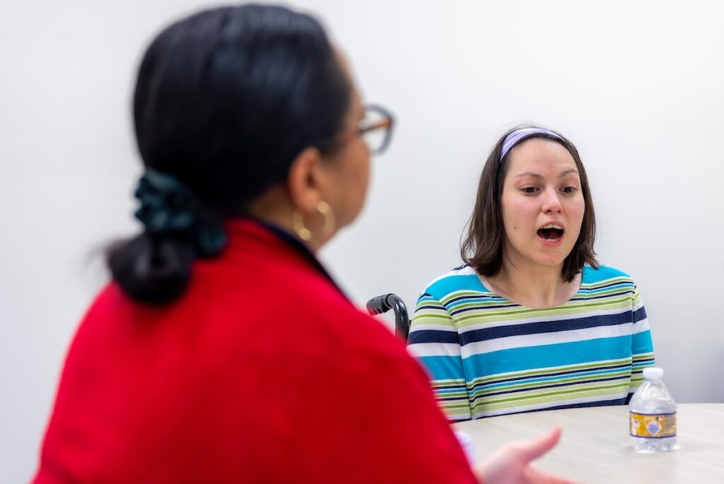 Staged photo of a client being worked with as part of Shenandoah University's free Speech, Language and Hearing Clinic in Loudoun.